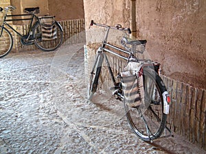 Old bicycles in a historical passage of Yazd , Iran