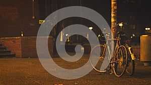 Old bicycles in lantern light in front of the Bochum Schauspielhaus, Germany photo