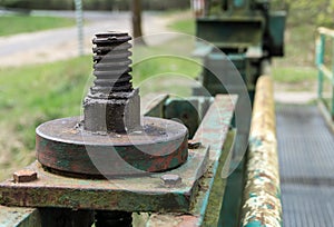 Old big screw and nut - part of the lock mechanism of dam - close-up