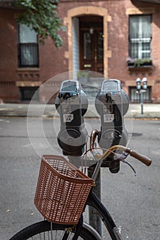 Old bike parked in front of a brownstone in Boston
