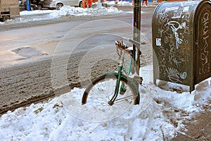 Old bike stuck in the snow. photo