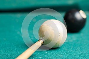 Old billiard ball 8 on a green table. billiard balls isolated on a green background