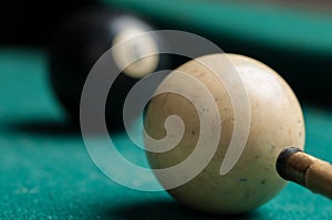 Old billiard ball 8 on a green table. billiard balls isolated on a green background