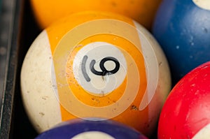 Old billiard balls and stick on a green table. billiard balls isolated on a green background