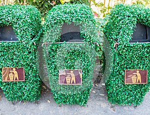 Old bin is covered with plastic vines