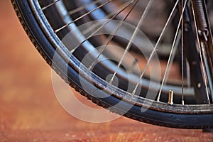 Old black bicycle wheel