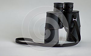 old black binoculars on a white background