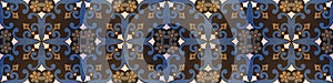 Old black blue brown vintage shabby patchwork mosaic tiles stone concrete cement wall texture background banner, with flower leaf