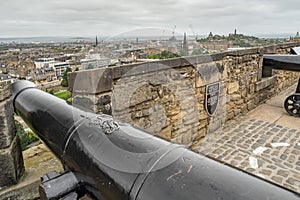 Old black cannon on a castle wall