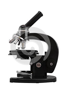 Old black classic four objectives microscope isolated on a white background