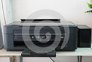 Old black desk scanner and inkjet printer