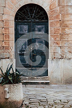 Old black doors. Wood texture. Texture of metal