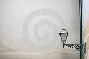 Old black iron vintage lamp, lantern on building wall