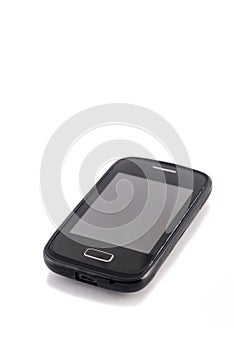 Old black mobile phone isolated on white background.