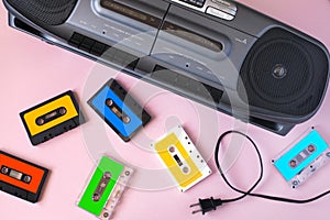 Old black retro cassette music audio tape recorder and retro cassette tape collection