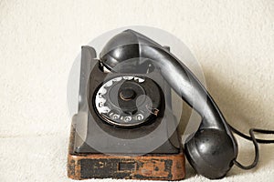 Old black retro phone on isolated background , rotary phone