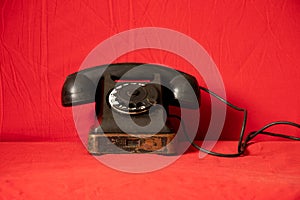 Old black retro phone on isolated background , rotary phone
