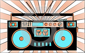 Old black retro vintage antique hipster obsolete cassette music audio tape recorder against the background of orange rays