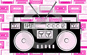 Old black retro vintage antique hipster obsolete cassette music audio tape recorder on the background of pink music audio cassette