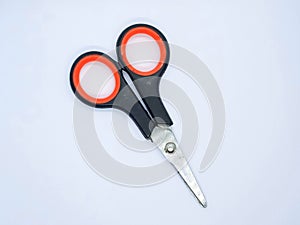 The old black scissor, isolated on the white gray background, negative space photo