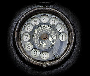 Old black telephone. Close-up of a rotary dial