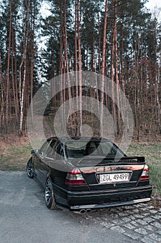 Old black tuned Mercedes Benz C-class W202 model