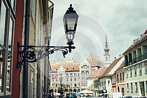 Old black vintage street lapm on the building in Budapest, Hungary.