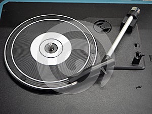 An old black vinyl record player.
