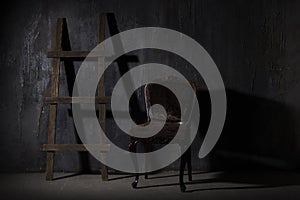 Old black wall.Grunge texture background wooden staircase in a dark room shadow