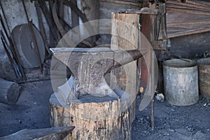 An old blacksmith anvil and tools