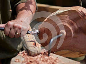 Old blacksmith at a flea market for medieval weapons