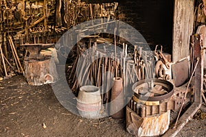 Old blacksmith workshop with tools and furnace