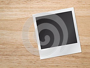 Old blank photograph on wooden