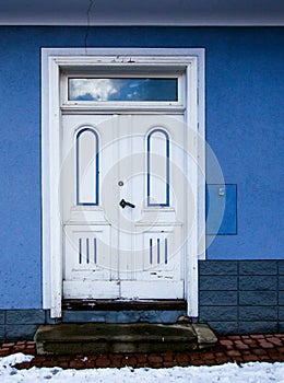 Old blie und white entrance door, porch view photo
