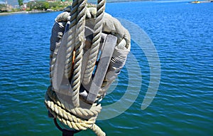 Old block with ropes on the ship