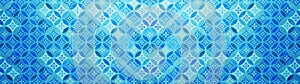 Old blue aquamarine pastel vintage shabby patchwork mosaic motif tiles stone concrete cement wall texture background with circle