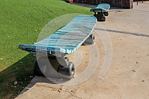 Old blue bench similar to a skateboard