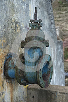 Old blue big drink water pipe with valve
