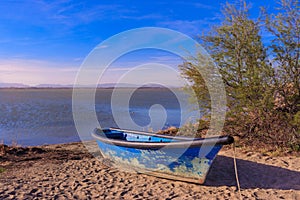 Old blue boat on the beach