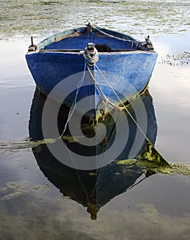 Old boat and reflexion photo