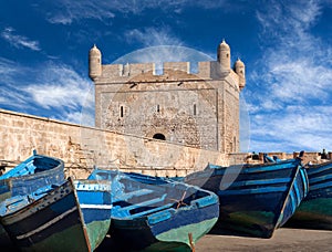 Old blue boats in harbour of Essaouira in Morocco