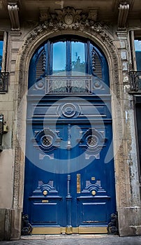 Old Blue carved ornate door in Paris, France.