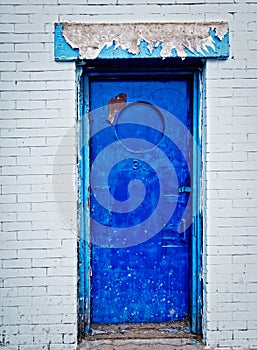 Old blue door and brick wall