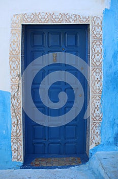 Old Blue Door with Hand Door Knocker