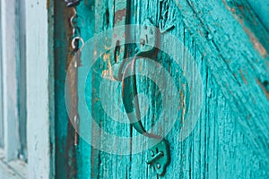 Old blue door handle closeup macro
