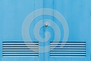 Old blue door with old door knob