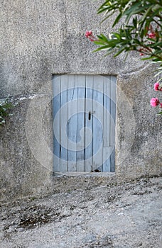 Old blue door on old facade