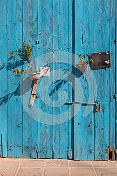 Old blue door with pots of flowers Larnaca, Cyprus