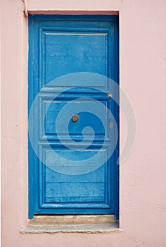 Old blue door or a rose colored home