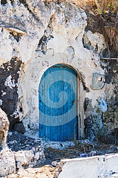 Old blue door in stone wall